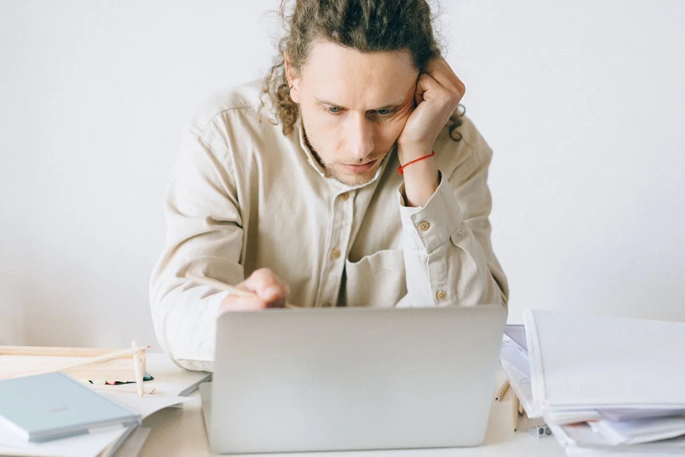 A person overwhelmed by repetitive office work