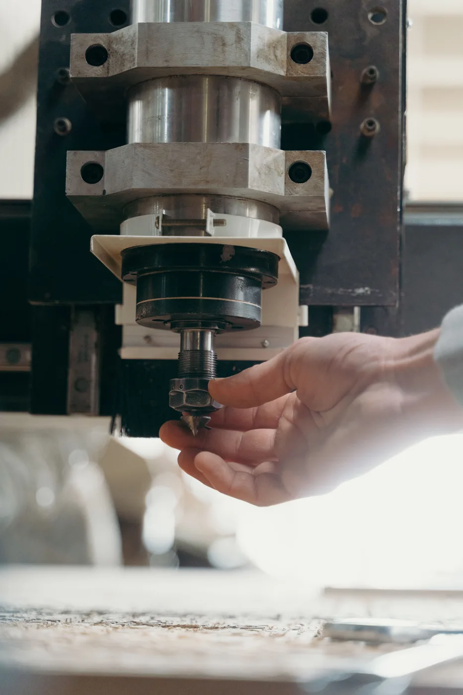 A worker maintaining industrial equipment