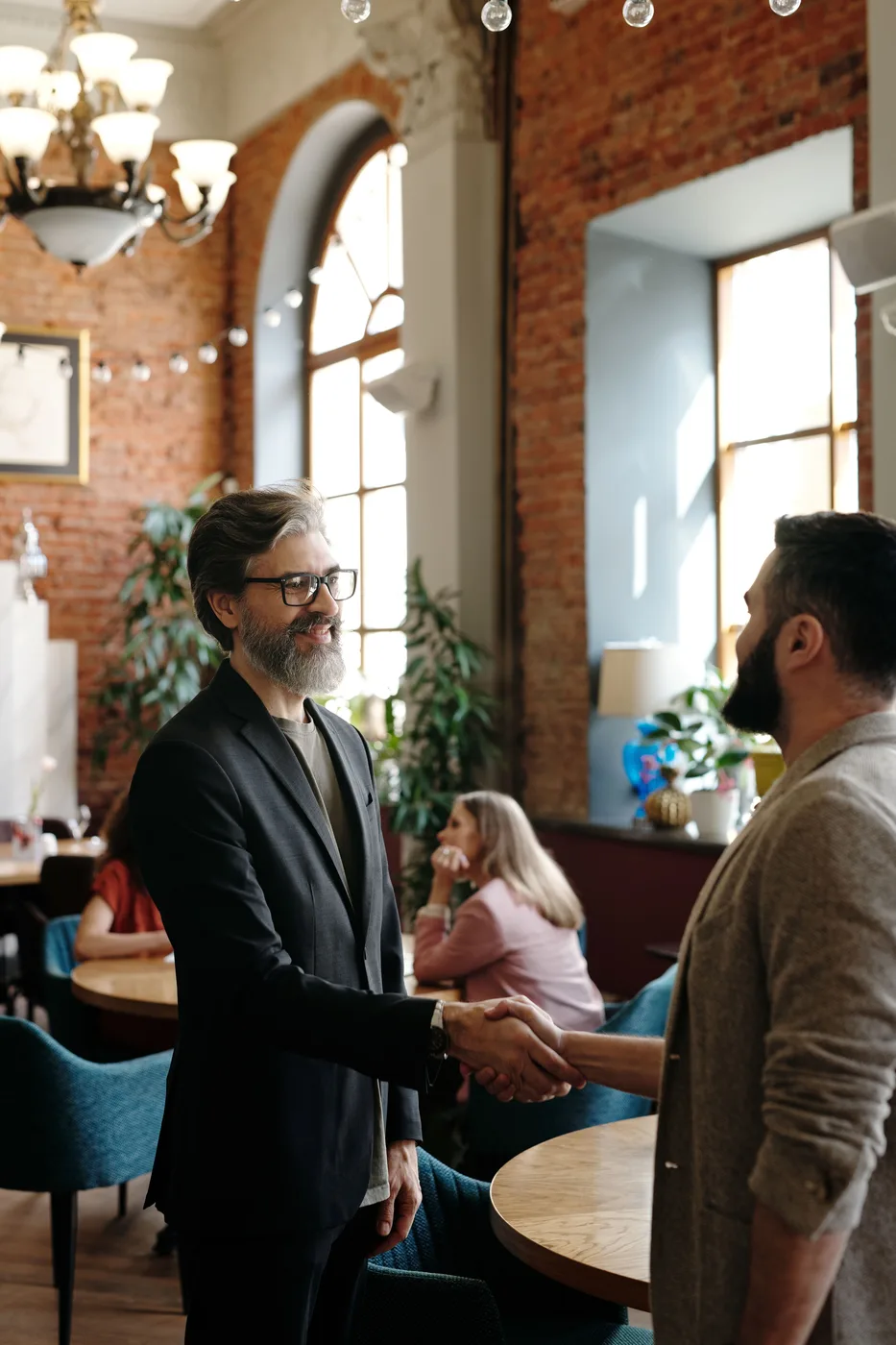 Two businesspeople greeting each other