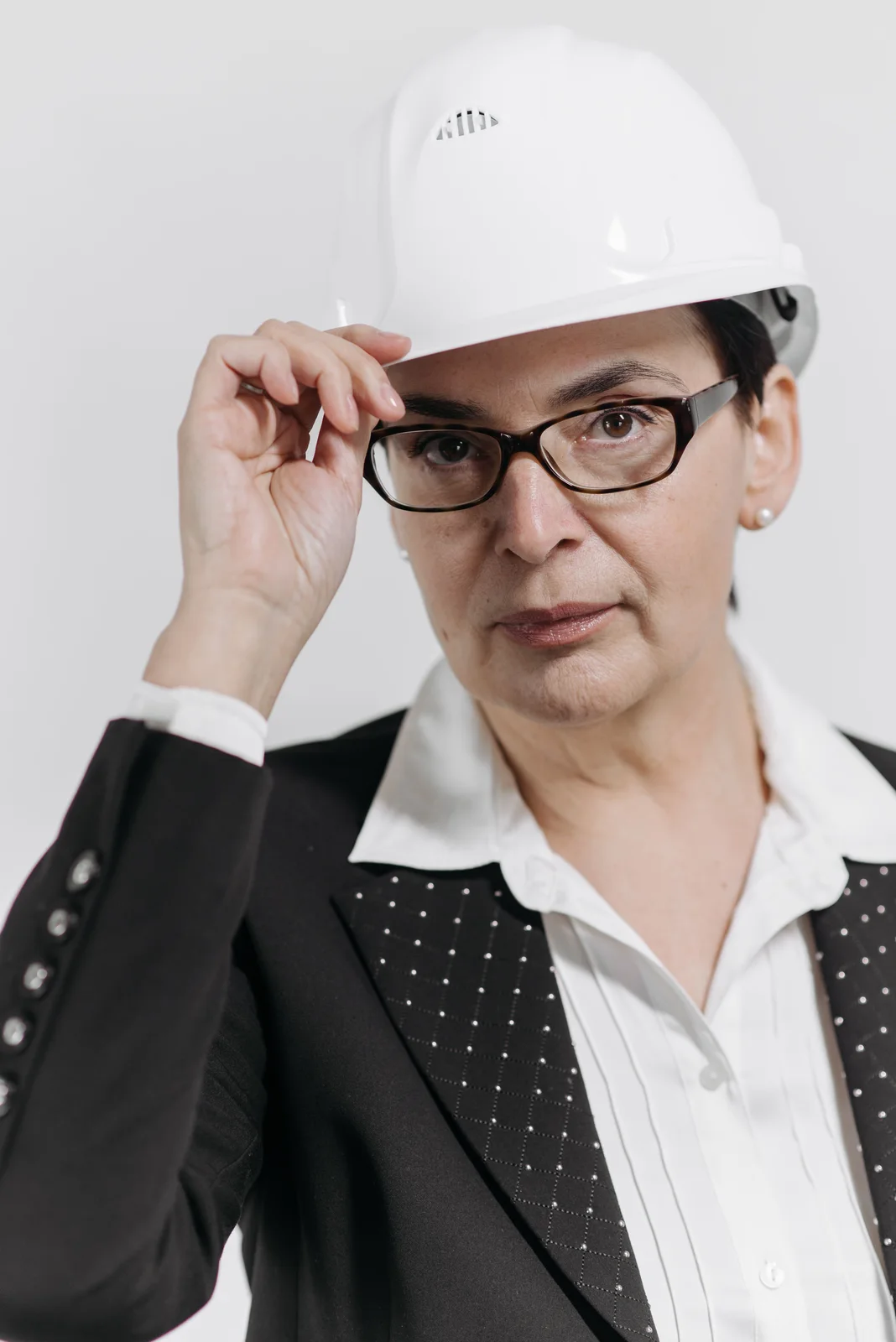 Experienced business professional wearing a hard hat